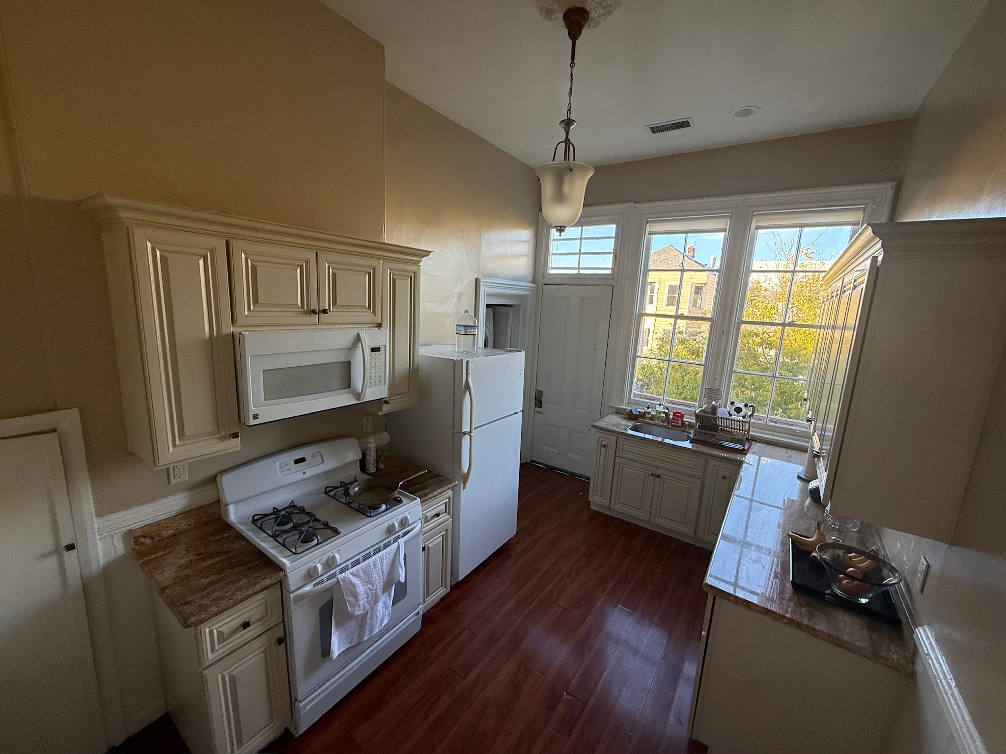 Kitchen with high ceilings and city views